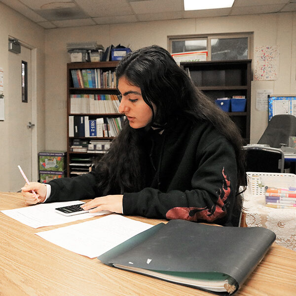 teen girl studying in classroom